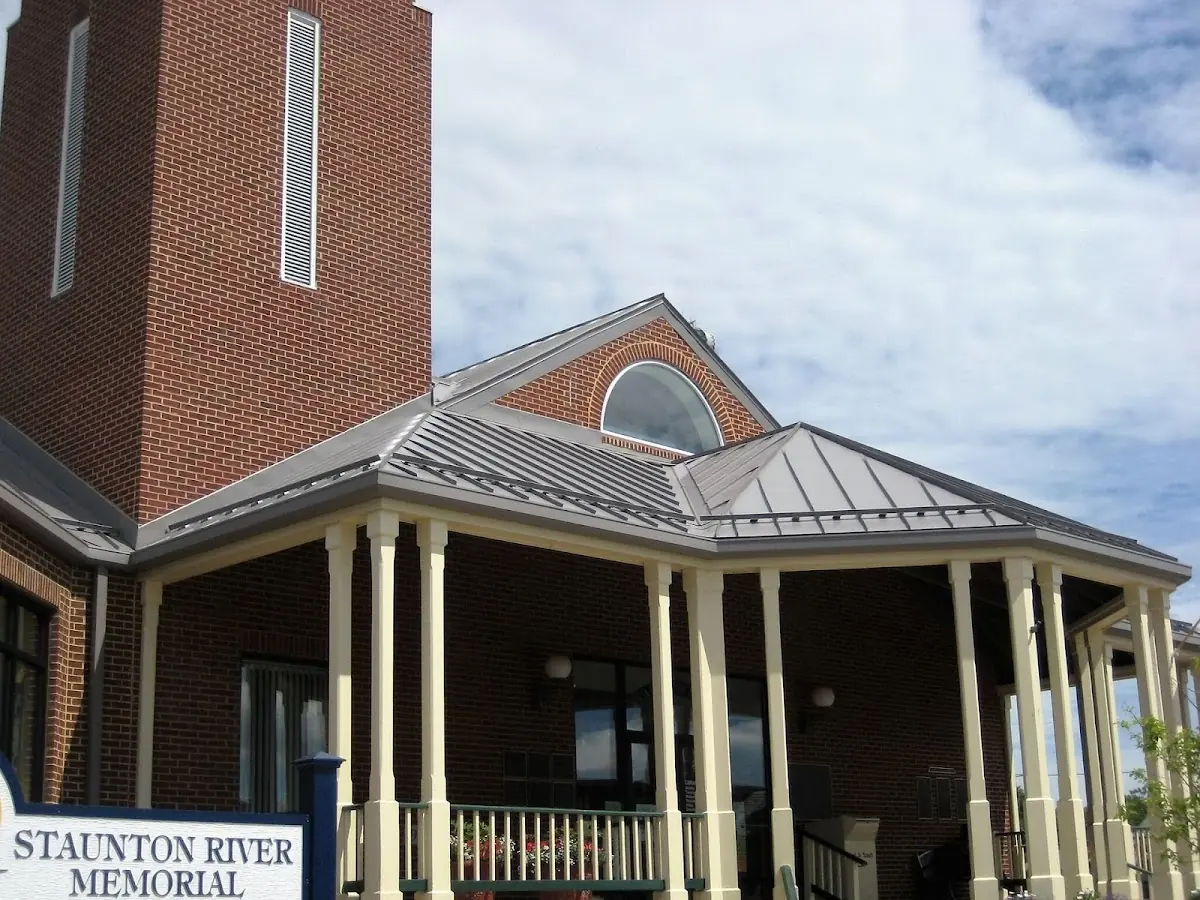Skilled roofing craftsmen working on a residential roof in Manitowoc
